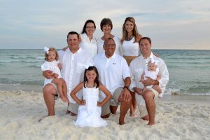 family all dressed in white and khaki