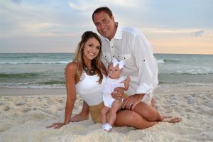 mom, dad and baby in a sunset beach photo Panama City