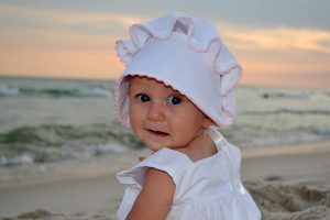 adorable baby in a sunset photo on Panama City Beach