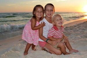 kids in a sunset beach photo on PCB