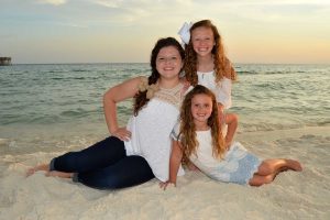 kids smiling in a family sunset beach photo