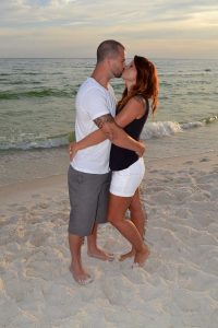 couple kissing in their sunset photo