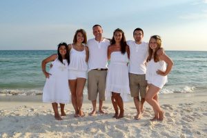 family smiling for camera