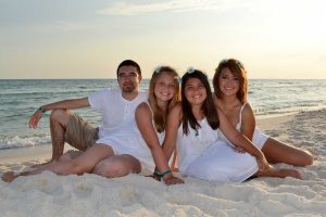 kids smiling in a beach photo