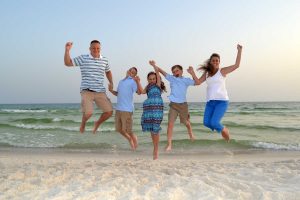 family jumping in air