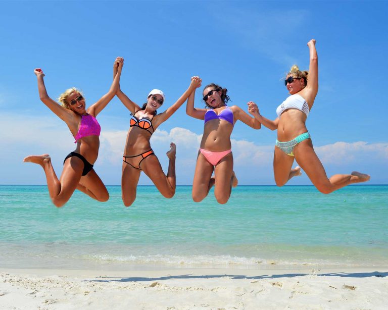 girls jumping in the air for an action shot photo