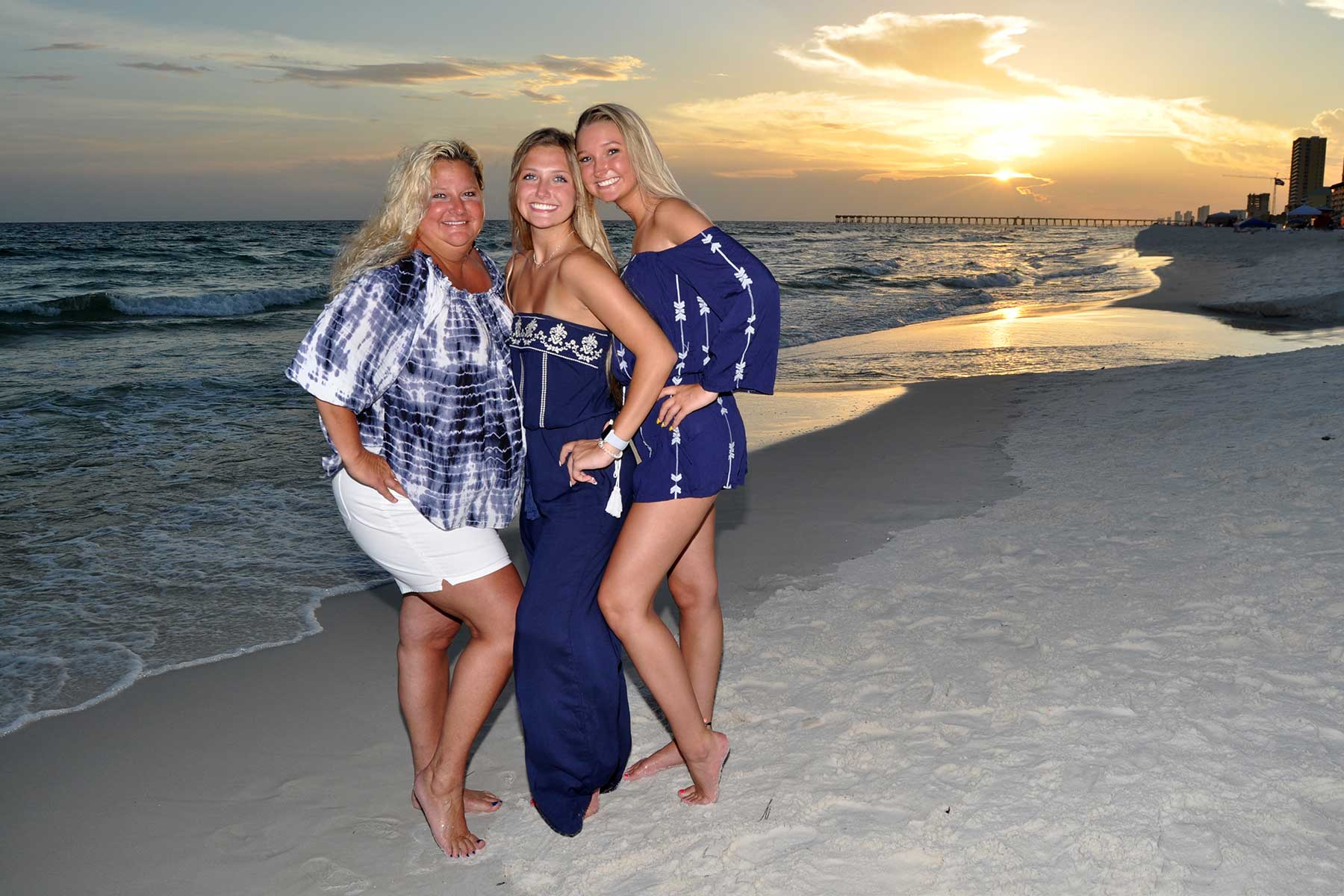 three women smiling for the camera in PCB