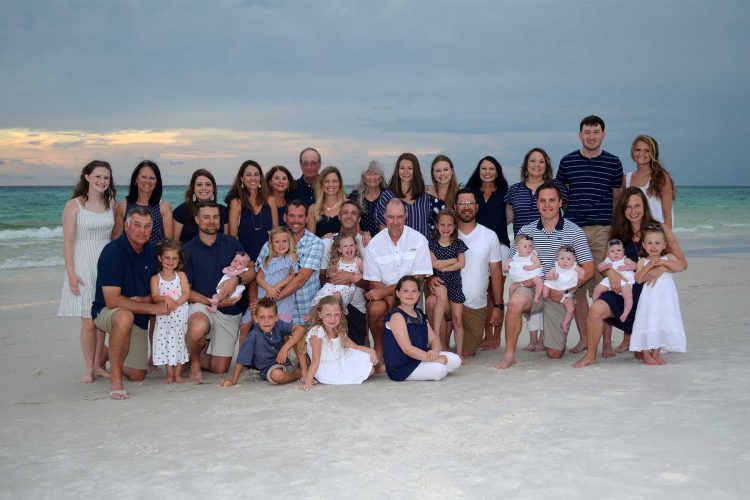 cute family reunion photo on the beach at sunset