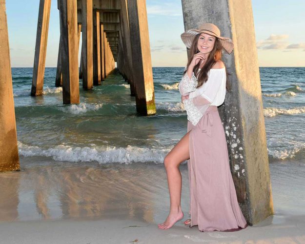 girl in senior photos on the beach