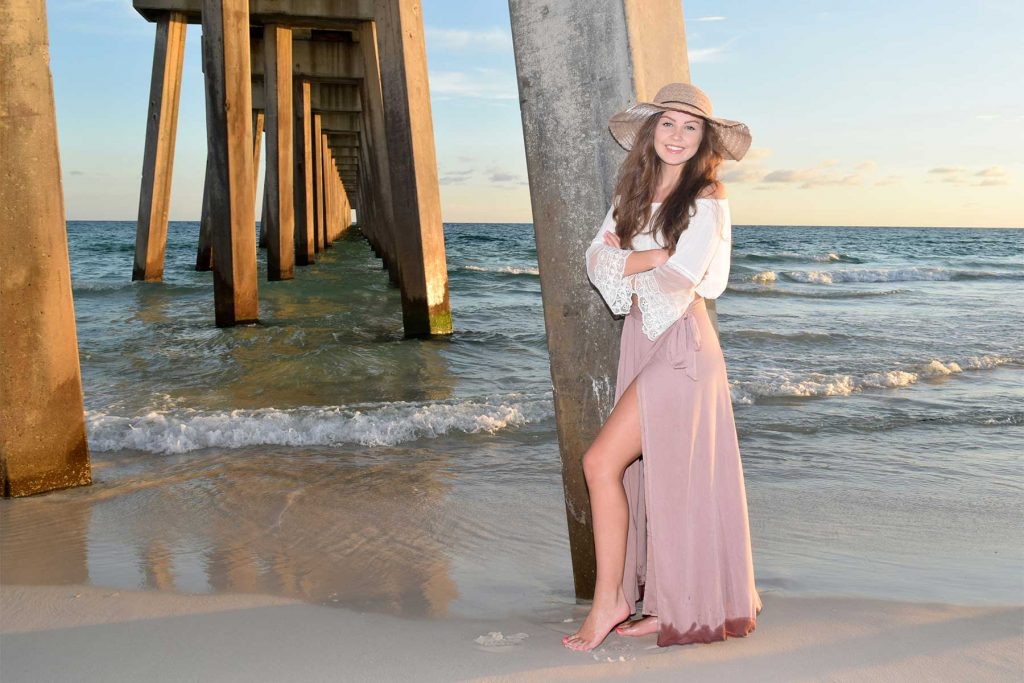 Stunning senior portrait / school photo on the beach at sunset. 