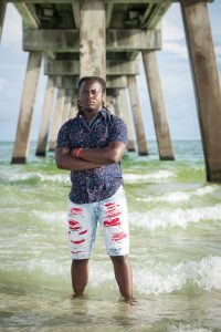 A senior getting his school picture taken on Panama City Beach