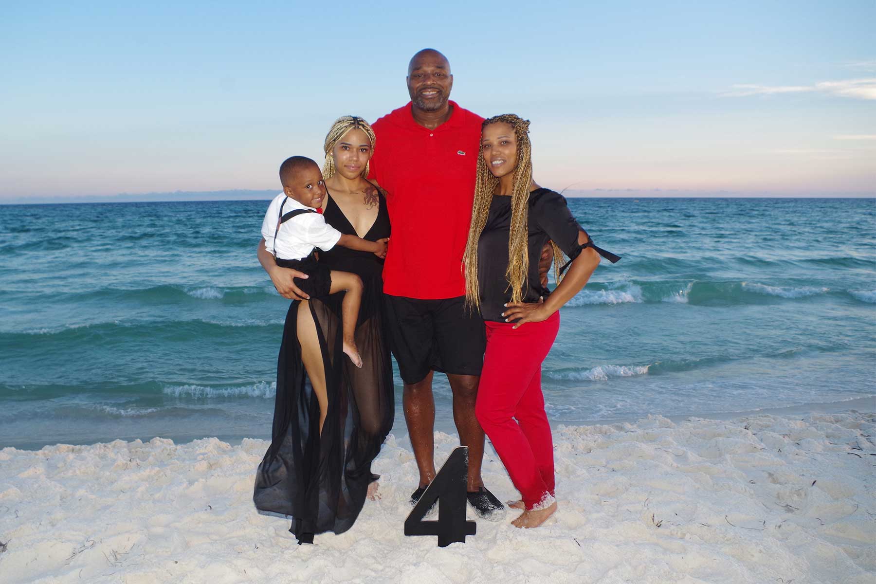 family posing for photo on Panama City Beach