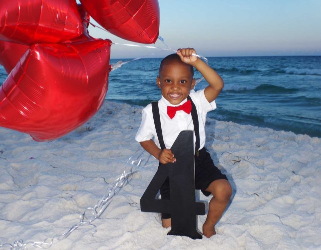 Little boy with balloons in special occastion photo