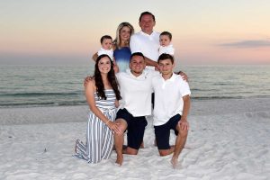 Baby and family at sunset