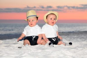Adorable twin boys in hats