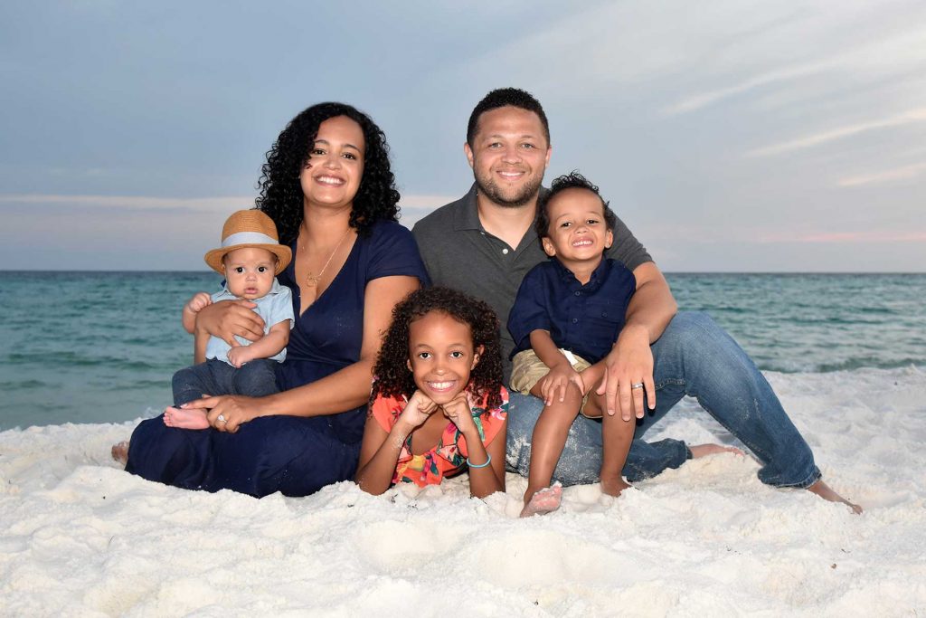 Our photographer in Panama City Beach takes family photo on beach