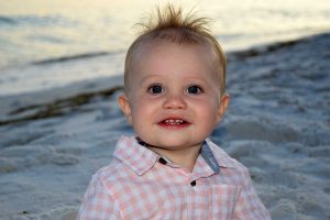 Sunset baby photos in Fort Walton Beach, like this photo, make great gifts for grandparents.