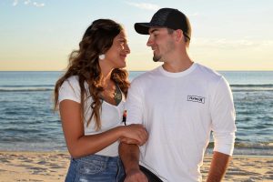 Photographer in Panama City Beach snaps a hug of this young couple.