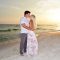 Couple kissing in their sunset beach photo on Panama City Beach