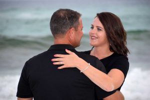 Couple looking into each other's eyes in their engagement photo