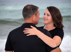 Couple looking into each other's eyes in their engagement photo