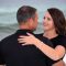 Couple looking into each other's eyes in their engagement photo