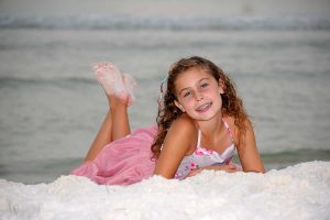 girl posing with sandy feet