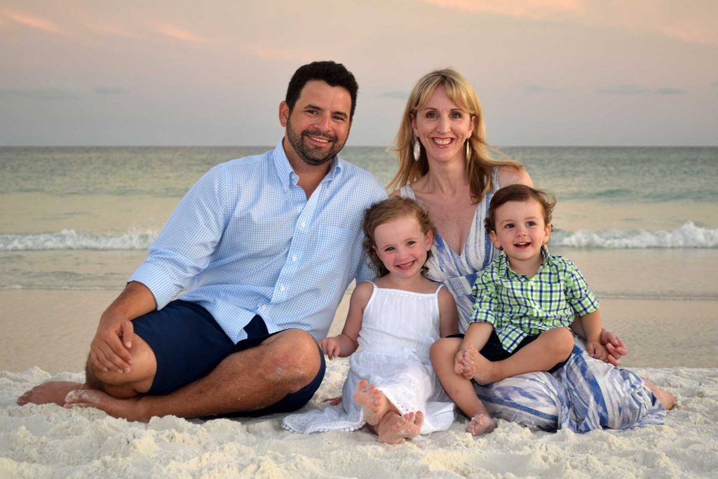 Family sitting on the sand