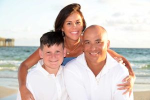 A hint of blue in family beach portraits adds a modern twist to the photograph.