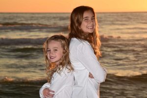 Beautiful photo of kids on Panama City Beach during the golden hour