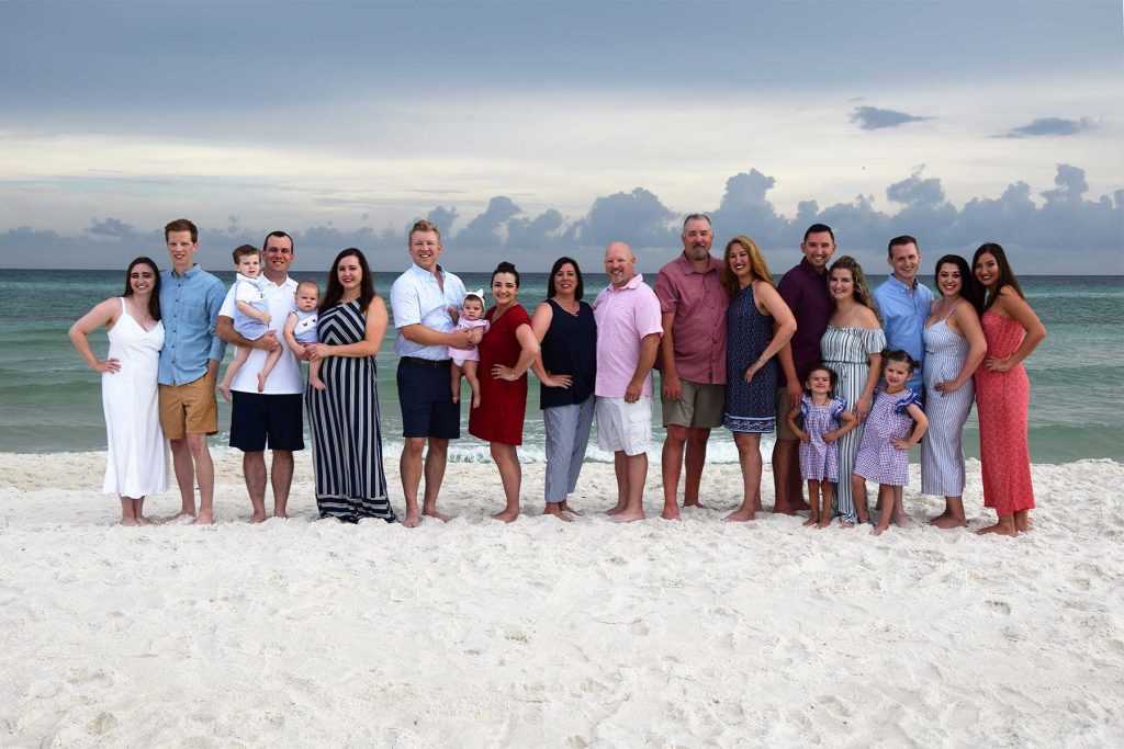Family group photo on Panama City Beach near condos, vacation rentals, and hotel accommodations