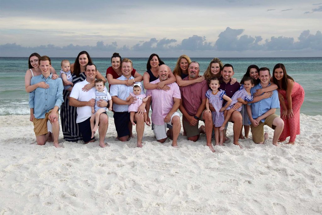 Family beach photo with a large family posing on PCB