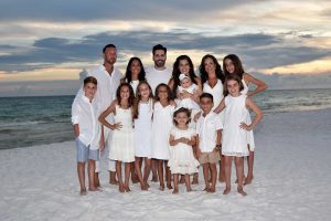 large family smiling for our PCB photographer
