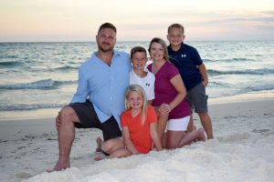 Child number 4 is being welcome by this loving family during thier photoshoot in PCB.