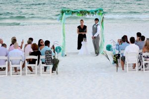 Our photographer captured this photo of the groom waiting at the alter for his bride.. This photo is from a wedding on the beach in PCB FL.