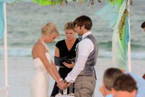 A shot of the bride and groom taking their vows.