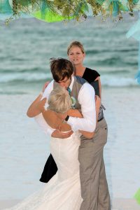 A photo of the groom kissing the bride.