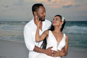 Another photo of a bride and groom in front of a sunset on PCB. We also offer wedding photos in Destin, Ft Walton Beach, and Miramar Beach, FL.