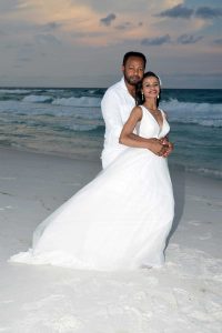 A gorgeous sunset wedding photo taken in Panama City Beach.