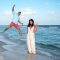 Photo of a surprise proposal in Panama City Beach - beautiful blue water, a happy couple and the engagement ring.