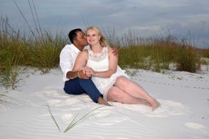 posing by sand dunes