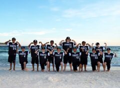 sports team getting their photo taken on Panama City Beach