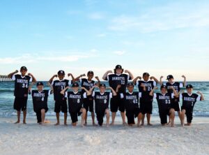 sports team getting their photo taken on Panama City Beach