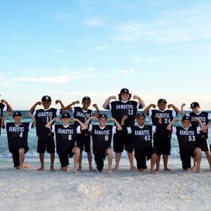 sports team getting their photo taken on Panama City Beach