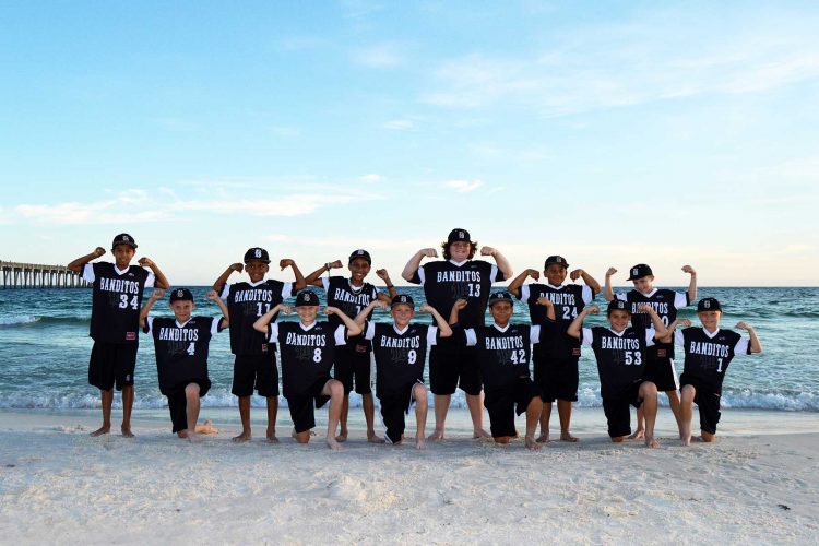 sports team getting their photo taken on Panama City Beach