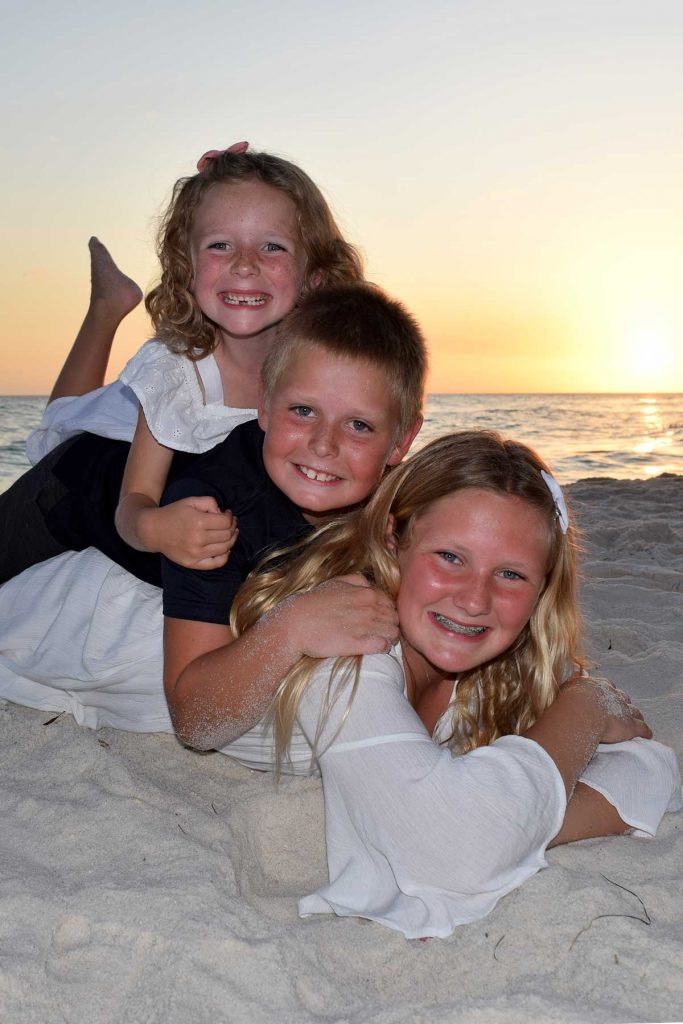 closeup of kids on beach at sunset