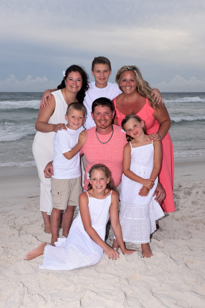 Family posing for their sunset photo