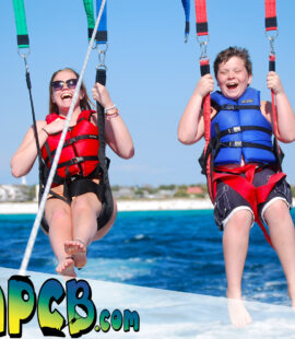 happy family parasailing