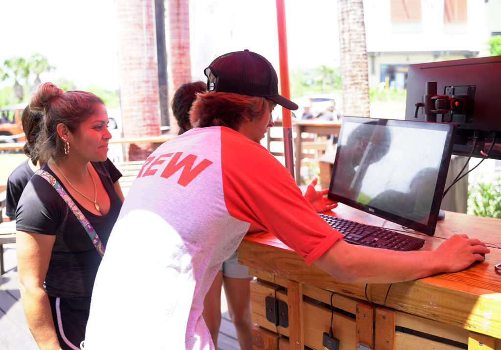 guy looking at photos on a screen