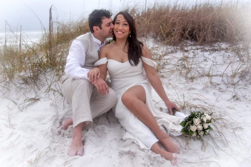 Posing near a sand dune.